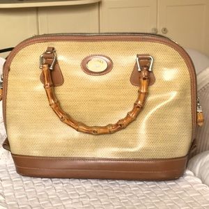 Perfect Dooney Bourke handbag w/leather trim, bamboo handles, zipper pulls